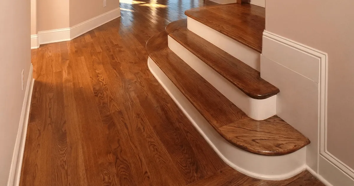 Base floor of a staircase with professionally restored wood flooring in Tempe AZ
