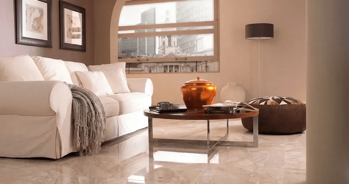 Modern living room with professionally installed marble flooring, a beige sofa, coffee table in Tempe, AZ